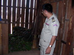 MOI official checking stored weapons