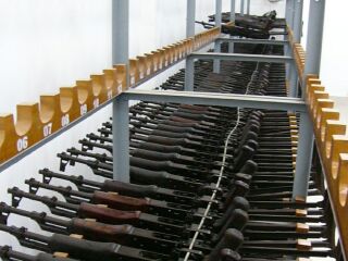 weapons secured on racks in weapons warehouse