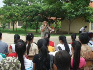 Police offical explaining to high school students