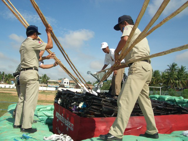 Pouring oil on bamboo sticks for the Flame of Peace